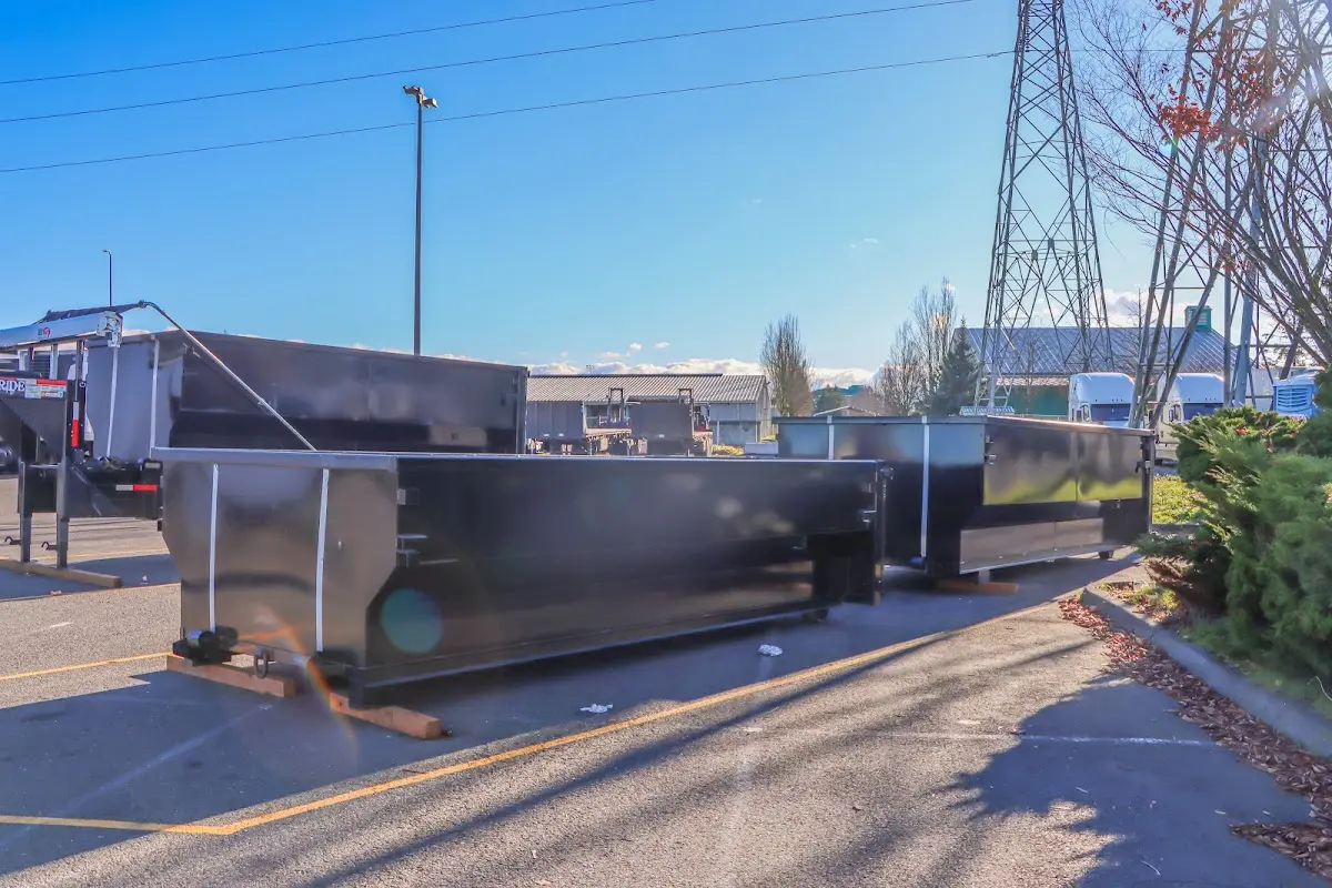 Roll-off dumpster ready for waste disposal at job site for 4 Yard Dumpster Rental in Webster